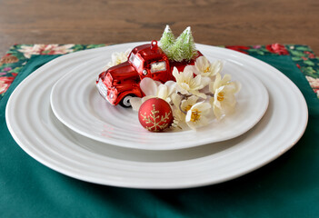 Holiday place setting for Christmas decorative table for seasonal dinner party or fancy wedding