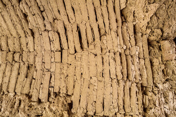 Close-up view of 2.5 thousand-year-old adobe brickwork of arch. Antique fortress Ayaz-Kala in Karakalpakstan, Uzbekistan. Fortification was built in the 3-4th century BC