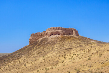 Desert fortress Ayaz-Kala 2, Karakalpakstan, Uzbekistan. Fortification was built on a hill 40 m high, towering over the sands of the Kyzylkum desert. Date of construction - 6-8 century AD