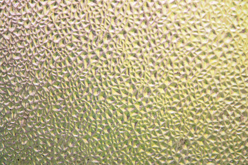 refreshing background: imitation of dew on a transparent surface, color toning, short focus.