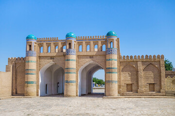Fototapeta na wymiar Kosh Darvaza (double gates in Uzbek) historical gate in Khiva, Uzbekistan. Built in 1912. Landmark of Dichan Kala or so called 'outer city'