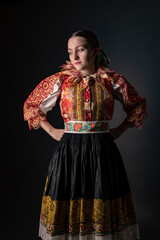 Young beautiful slovak woman in traditional dress. Slovak folklore