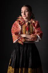Young beautiful slovak woman in traditional dress. Slovak folklore