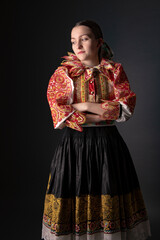 Young beautiful slovak woman in traditional dress. Slovak folklore