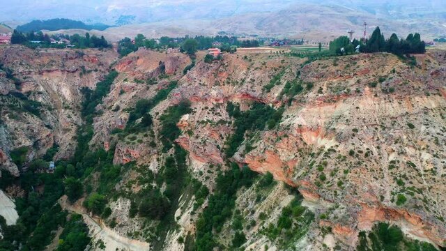 Aerial Beautiful Shot Of Houses On Mountain Top, Drone Flying Forward Over Green Plants - Bsharri, Lebanon