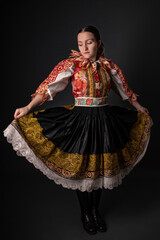 Young beautiful slovak woman in traditional dress. Slovak folklore