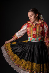 Young beautiful slovak woman in traditional dress. Slovak folklore