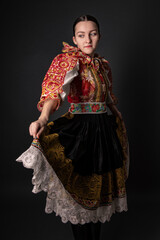 Young beautiful slovak woman in traditional dress. Slovak folklore