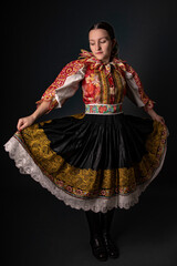 Young beautiful slovak woman in traditional dress. Slovak folklore