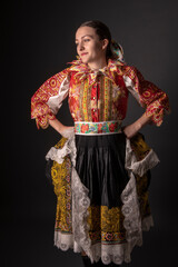 Young beautiful slovak woman in traditional dress. Slovak folklore