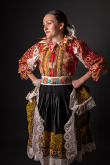 Young beautiful slovak woman in traditional dress. Slovak folklore