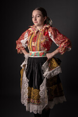 Young beautiful slovak woman in traditional dress. Slovak folklore