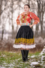 Young beautiful slovak woman in traditional dress. Slovak folklore