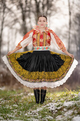 Young beautiful slovak woman in traditional dress. Slovak folklore