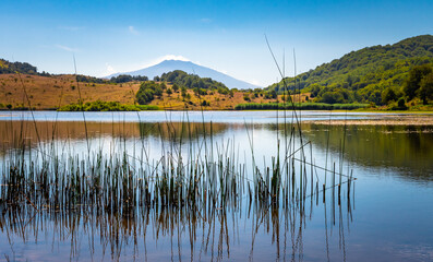 View of Biviere lake with Etna volcano, Nebrodi National Park, Sicily, Italy