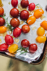 red, yellow, orange cherry grape tomatoes for roasting with rosemary