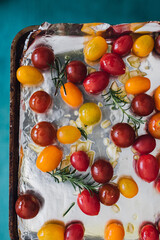 red, yellow, orange cherry grape tomatoes for roasting with rosemary