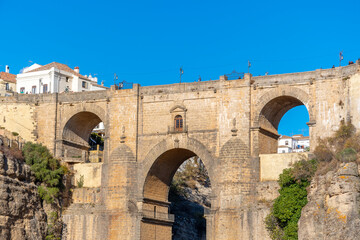 Fototapeta na wymiar Panoramic view of the canyon, old town and bridge in the medieval city of Ronda, Spain, in the Southern Andalusia region. 