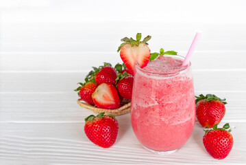 Strawberry yogurt fruit juice smoothie pink colorful fruit juice milkshake blend beverage healthy high protein the taste yummy In glass drink episode morning on white wood background.