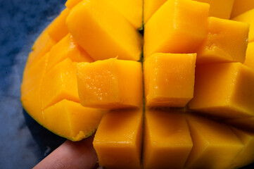 Ripe and tasty egyption Mango cubes. macro shot
