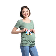 Young pregnant woman with baby socks on white background