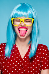 glamorous woman in blue wig yellow glasses posing model