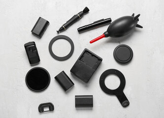 Photo equipment on light table background, top view