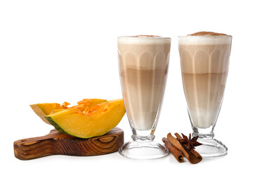 Glasses of tasty pumpkin latte on white background
