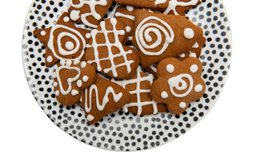 Gingerbreads on the plate isolated the white background