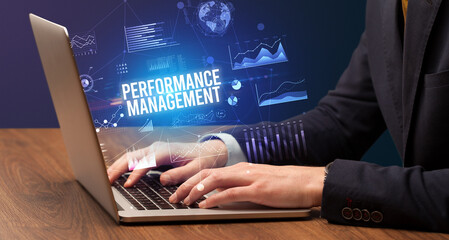 Businessman working on laptop, business concept