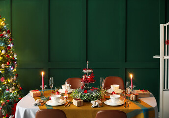 Dining table with beautiful setting in living room decorated for Christmas eve - obrazy, fototapety, plakaty