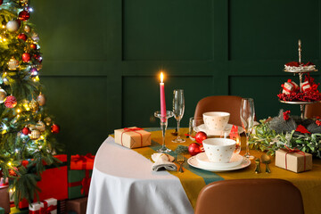 Dining table with beautiful setting in living room decorated for Christmas eve