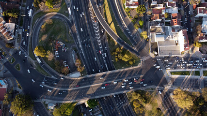 Aerial top down view of vehicular traffic on modern multilevel interstate overpass in Buenos Aires. Argentina