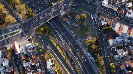 Aerial top down view of vehicular traffic on modern multilevel interstate overpass in Buenos Aires. Argentina. South America © Santiago