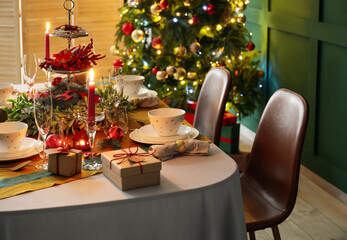 Dining table with beautiful setting in living room decorated for Christmas eve