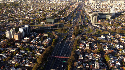 Aerial top down view of vehicular traffic on modern multilevel interstate overpass in Buenos Aires....
