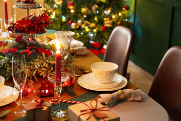 Dining table with setting for Christmas celebration indoors