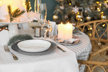 Dining table with setting for Christmas celebration indoors