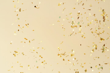 Many flying confetti on color background