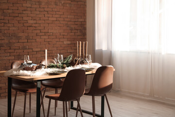 Dining table with setting for Christmas celebration indoors