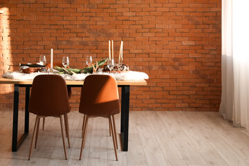 Dining table with setting for Christmas celebration indoors