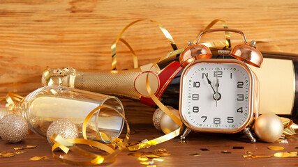 Fototapeta premium Stylish New Year clock and Christmas decor on table