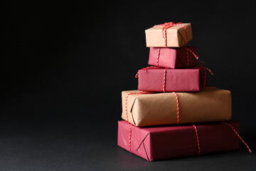 Beautiful Christmas gift boxes on black background