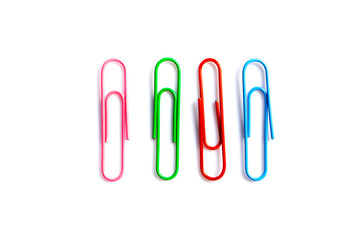 olorful paper clips on white background with copy space.