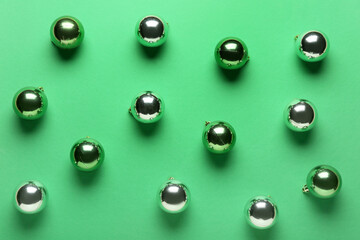 Beautiful Christmas balls on green background