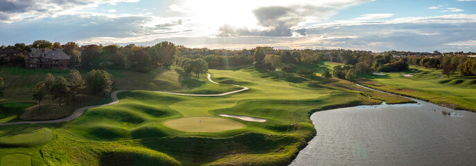 Aerial golf course images of scenic golf holes. - Powered by Adobe