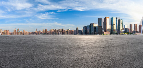 Panoramic skyline and modern commercial office buildings with empty road. Asphalt road and...