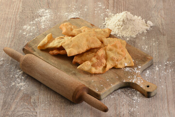 Puff pastry, flakes on a cutting board, traditional food in colombia south america