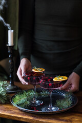 Festive mulled wine on the background of a candle with smoke