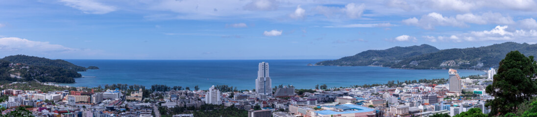 view of Patong and patong beach with the buildings and high-rise hotels and resorts in the background Kathu phuket Thailand 
